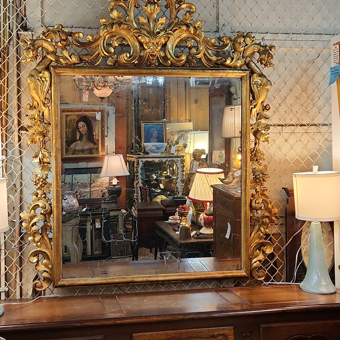 LARGE 19TH CENTURY GILT GESSO AND WOOD MIRROR WITH GRIFFINS AND MASK PEDIMENT