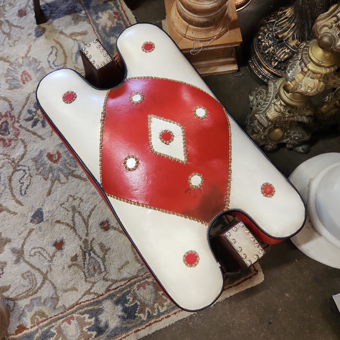 CAMEL STOOL WITH RED AND WHITE CUSHION