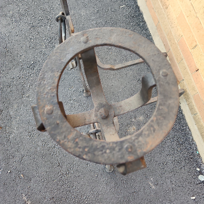 PAIR OF TALL BLACK FLAT IRON ANDIRONS WITH RINGS AND BASKET TOPS