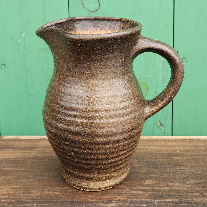 HAND THROWN BROWN RIBBED POTTERY PITCHER