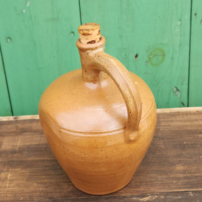 HAND THROWN BROWN GLAZED POTTERY JUG WITH HANDLE