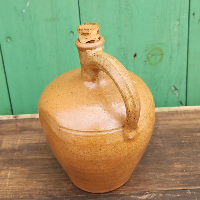 HAND THROWN BROWN GLAZED POTTERY JUG WITH HANDLE