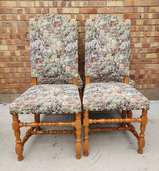 SET OF FOUR UPHOLSTERED ARCHED BACK CHAIRS