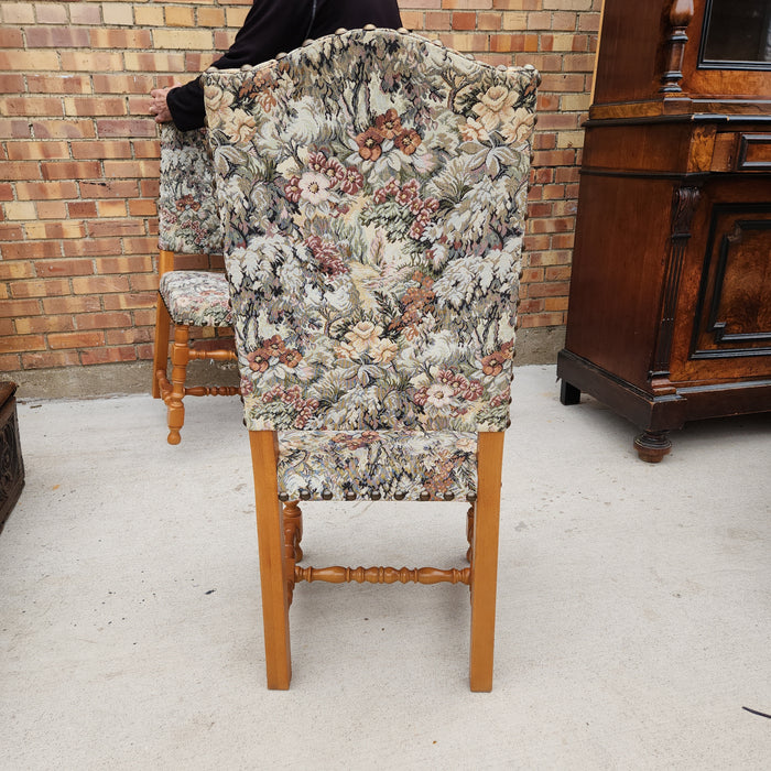 SET OF FOUR UPHOLSTERED ARCHED BACK CHAIRS