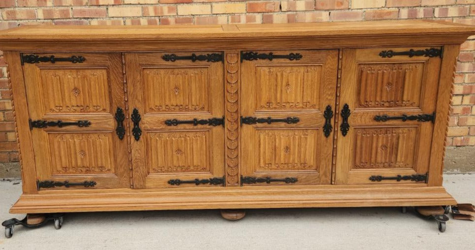 OAK SIDE BOARD WITH LINEN FOLD AND IRON HINGES