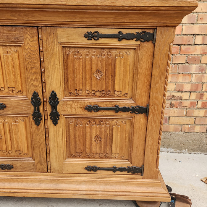 OAK SIDE BOARD WITH LINEN FOLD AND IRON HINGES