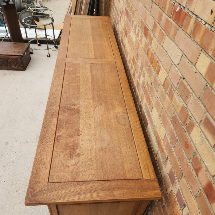OAK SIDE BOARD WITH LINEN FOLD AND IRON HINGES