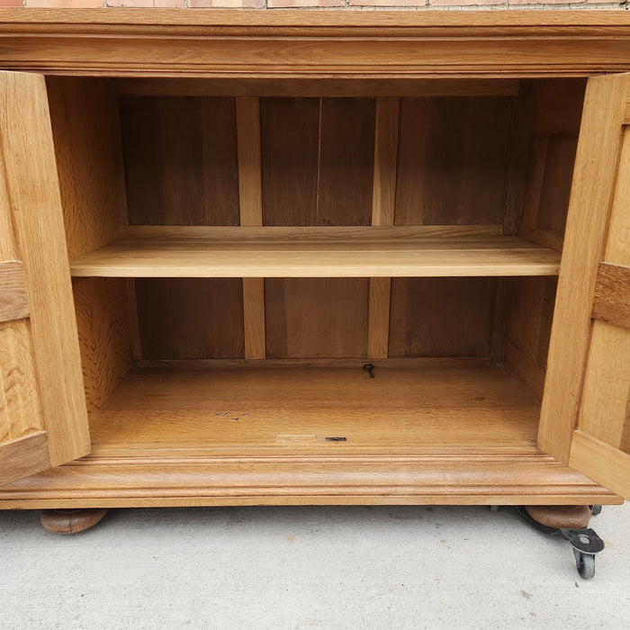 OAK SIDE BOARD WITH LINEN FOLD AND IRON HINGES
