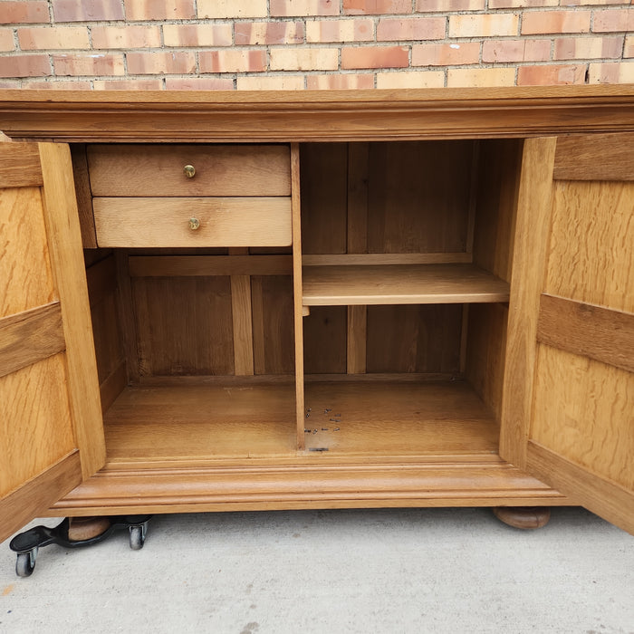 OAK SIDE BOARD WITH LINEN FOLD AND IRON HINGES