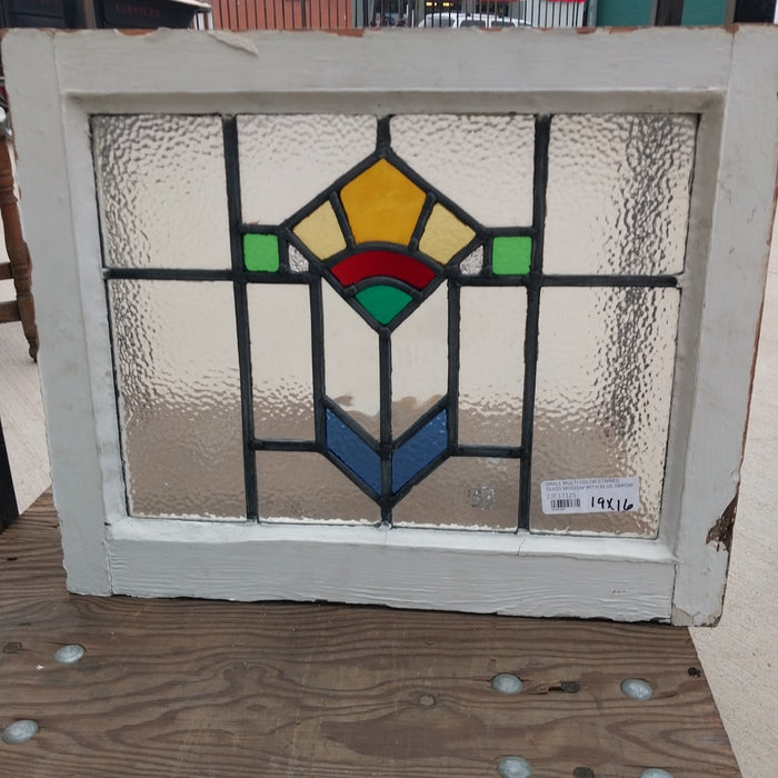 SMALL MULTI COLOR STAINED GLASS WINDOW WITH BLUE ARROW