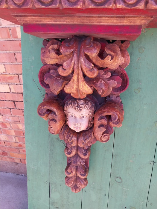 EARLY PAIR OF TALL POLYCHROME CARVED WOOD CHERUB WALL SCONCES