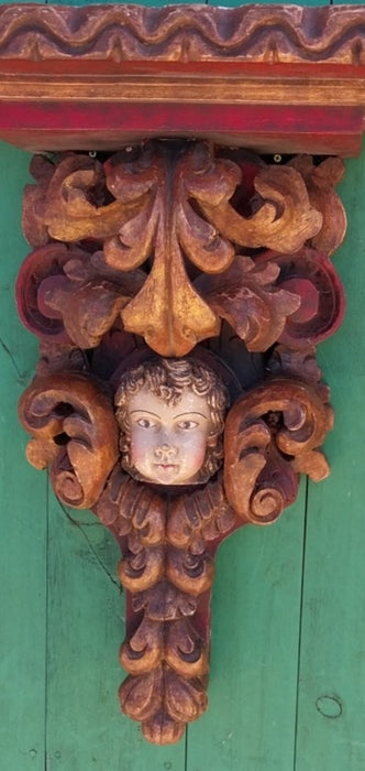 EARLY PAIR OF TALL POLYCHROME CARVED WOOD CHERUB WALL SCONCES