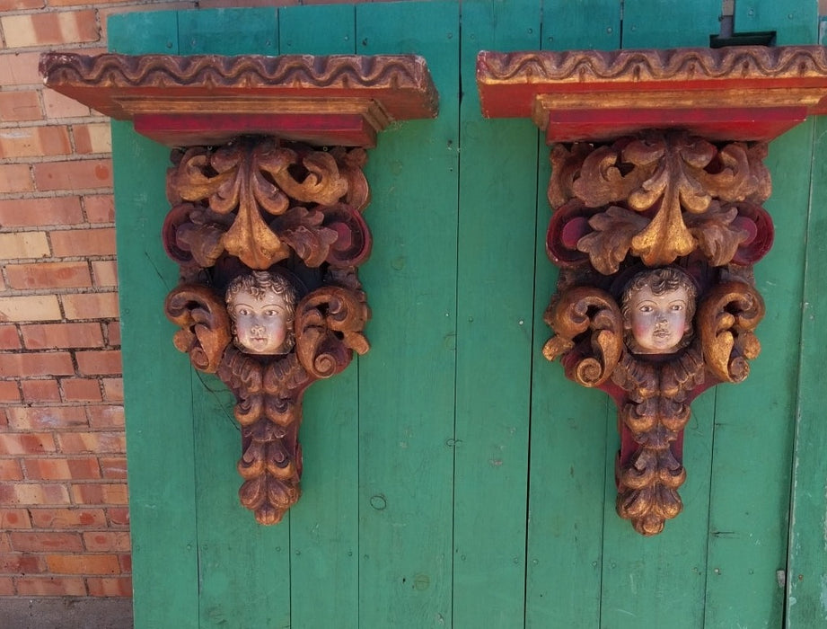 EARLY PAIR OF TALL POLYCHROME CARVED WOOD CHERUB WALL SCONCES