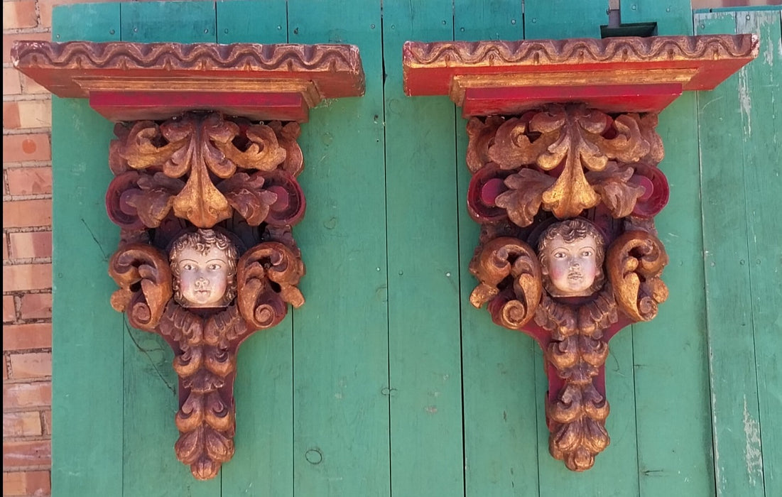 EARLY PAIR OF TALL POLYCHROME CARVED WOOD CHERUB WALL SCONCES