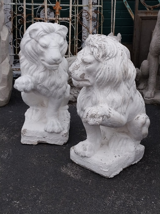 PAIR OF PAINTED CONCRETE LIONS WITH RAISED PAWS