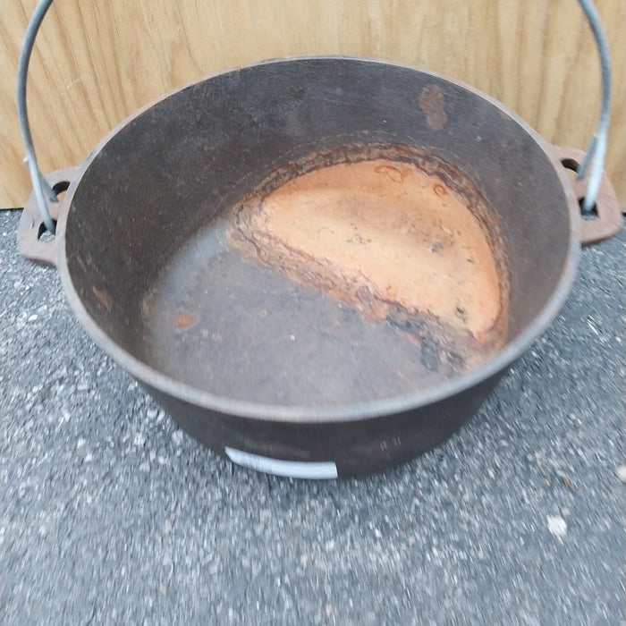 CAST IRON KETTLE WITH WIRE HANDLE - AS FOUND