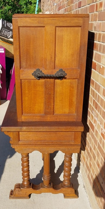 LONG OAK LINENFOLD CABINET WITH IRON STRETCHER AND HANDLES