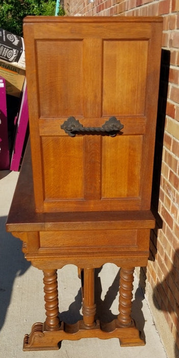 LONG OAK LINENFOLD CABINET WITH IRON STRETCHER AND HANDLES