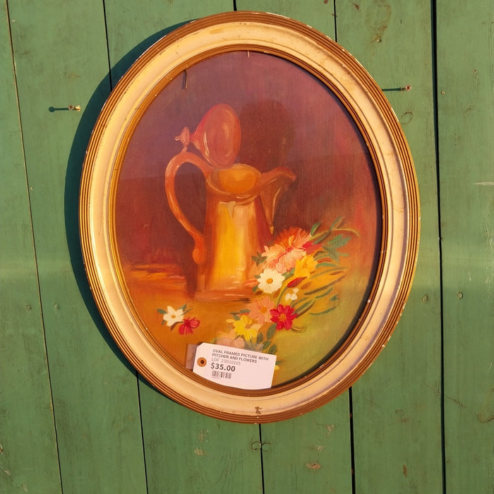 OVAL FRAMED PICTURE WITH PITCHER AND FLOWERS