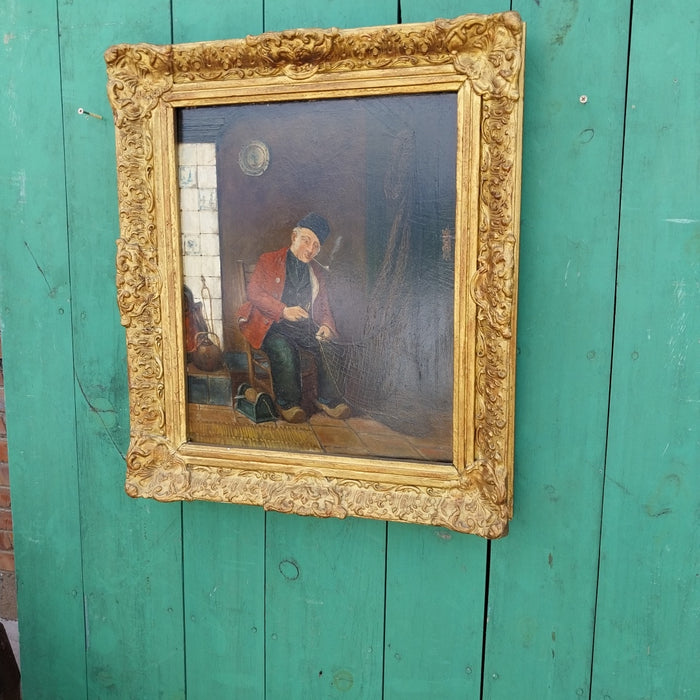 19TH CENTURY GILT FRAMED OIL PAINTING OF INTERIOR WITH DUTCHMAN