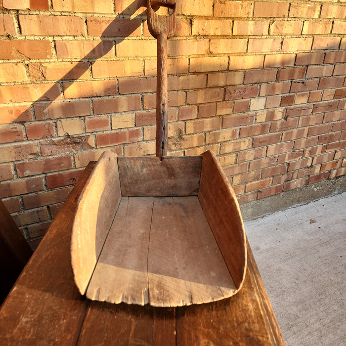 LARGE PRIMITIVE WOOD SCOOP ON STAND