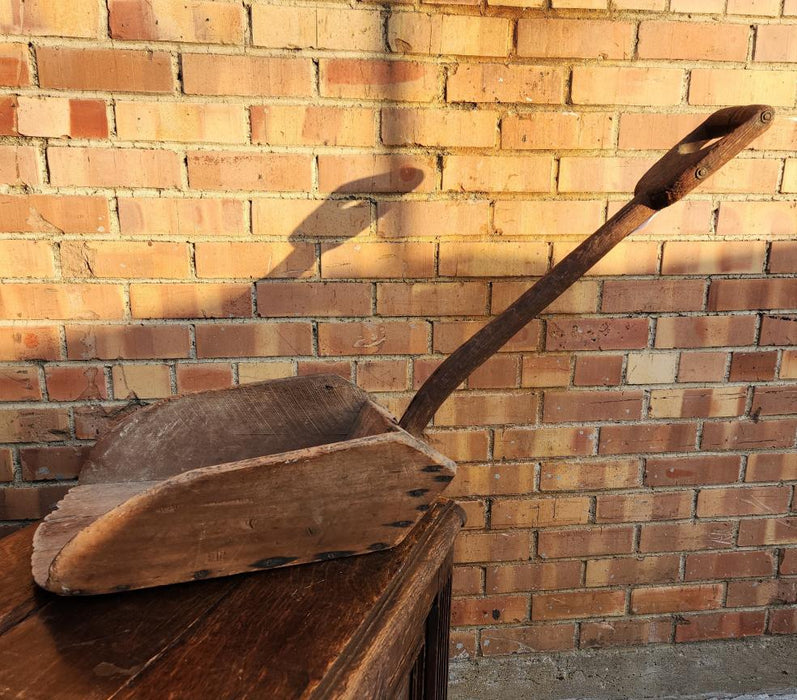 LARGE PRIMITIVE WOOD SCOOP ON STAND