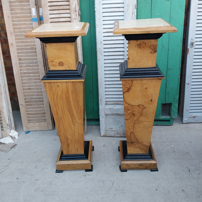 PAIR OF MARBLE TOP EBONIZED AND BURLED PEDESTALS