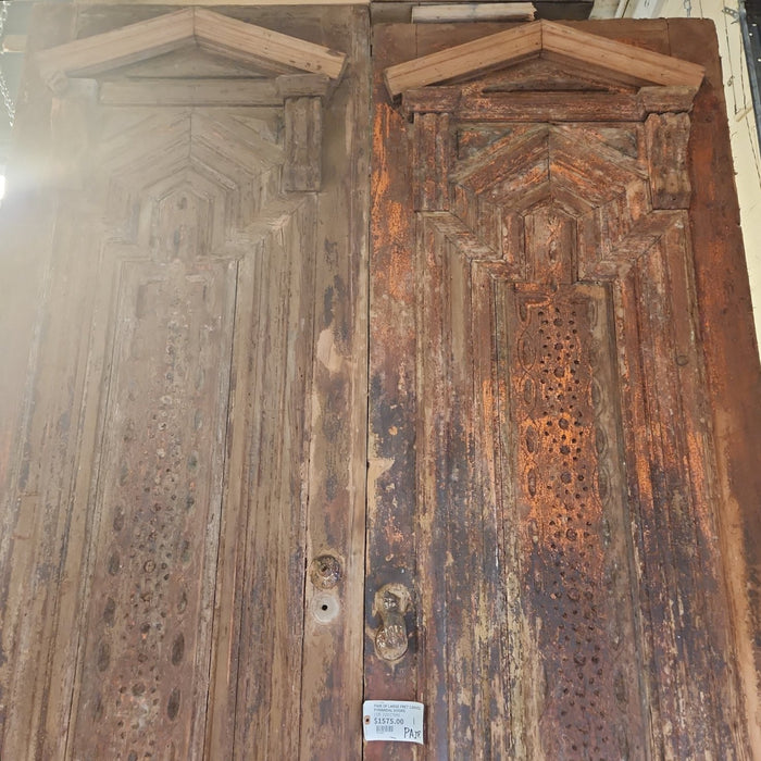 PAIR OF LARGE FRET CARVED PYRIMIDAL DOORS