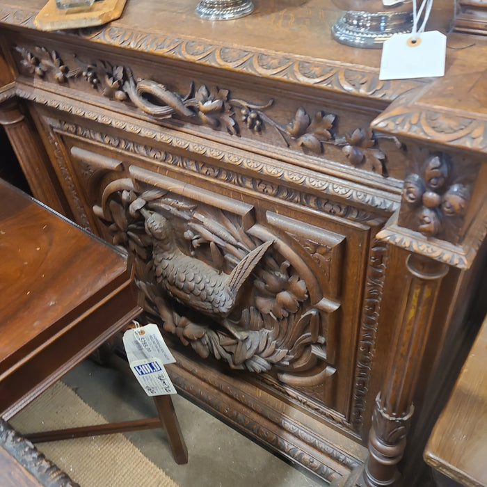 NARROW OAK HUNTBOARD WITH BIRD AND GRIFFINS