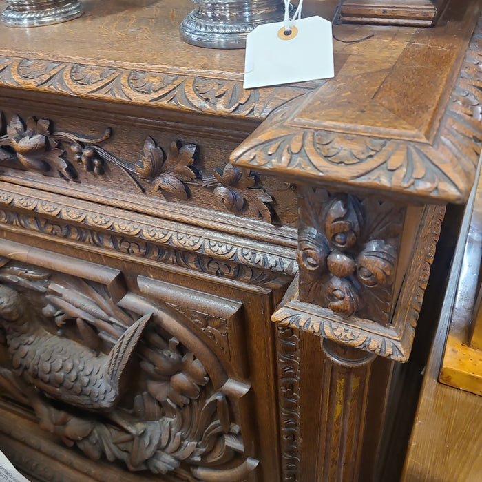 NARROW OAK HUNTBOARD WITH BIRD AND GRIFFINS