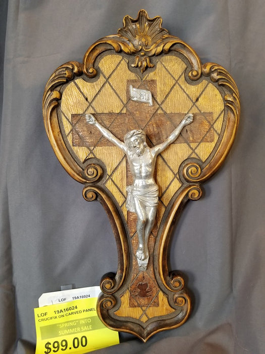 WHITE METAL CRUCIFIX ON WOOD CARVED PANEL