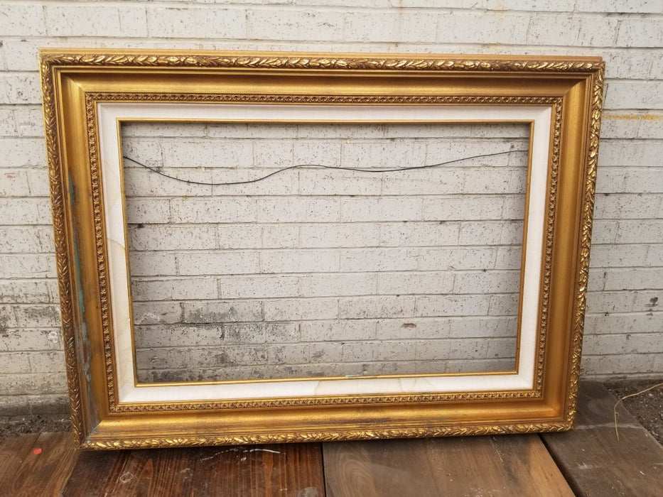 LARGE GOLD FRAME WITH WHITE LINER