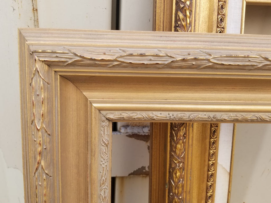 GOLD FRAME WITH CARVED EDGES