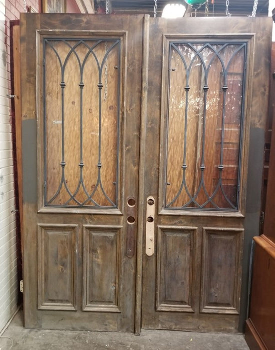 PAIR OF WOOD DOORS WITH GOTHIC IRON INSET WINDOWS