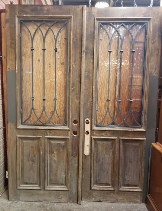 PAIR OF WOOD DOORS WITH GOTHIC IRON INSET WINDOWS