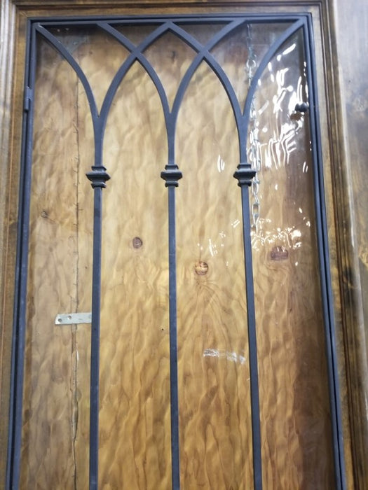 PAIR OF WOOD DOORS WITH GOTHIC IRON INSET WINDOWS