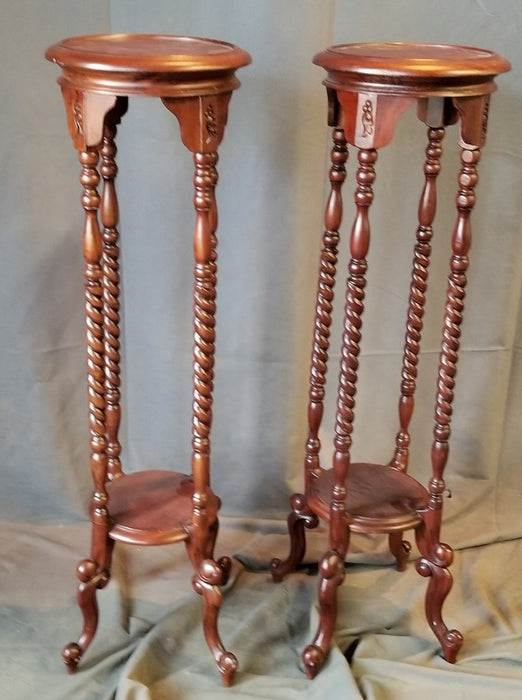 PAIR OF INDONESIAN MAHOGANY PLANT STANDS with 4 twist columns