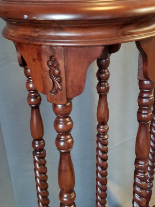 PAIR OF INDONESIAN MAHOGANY PLANT STANDS with 4 twist columns
