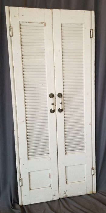 PAIR OF PAINTED LOUVERED DOORS WITH BEAUTIFUL HANDLES