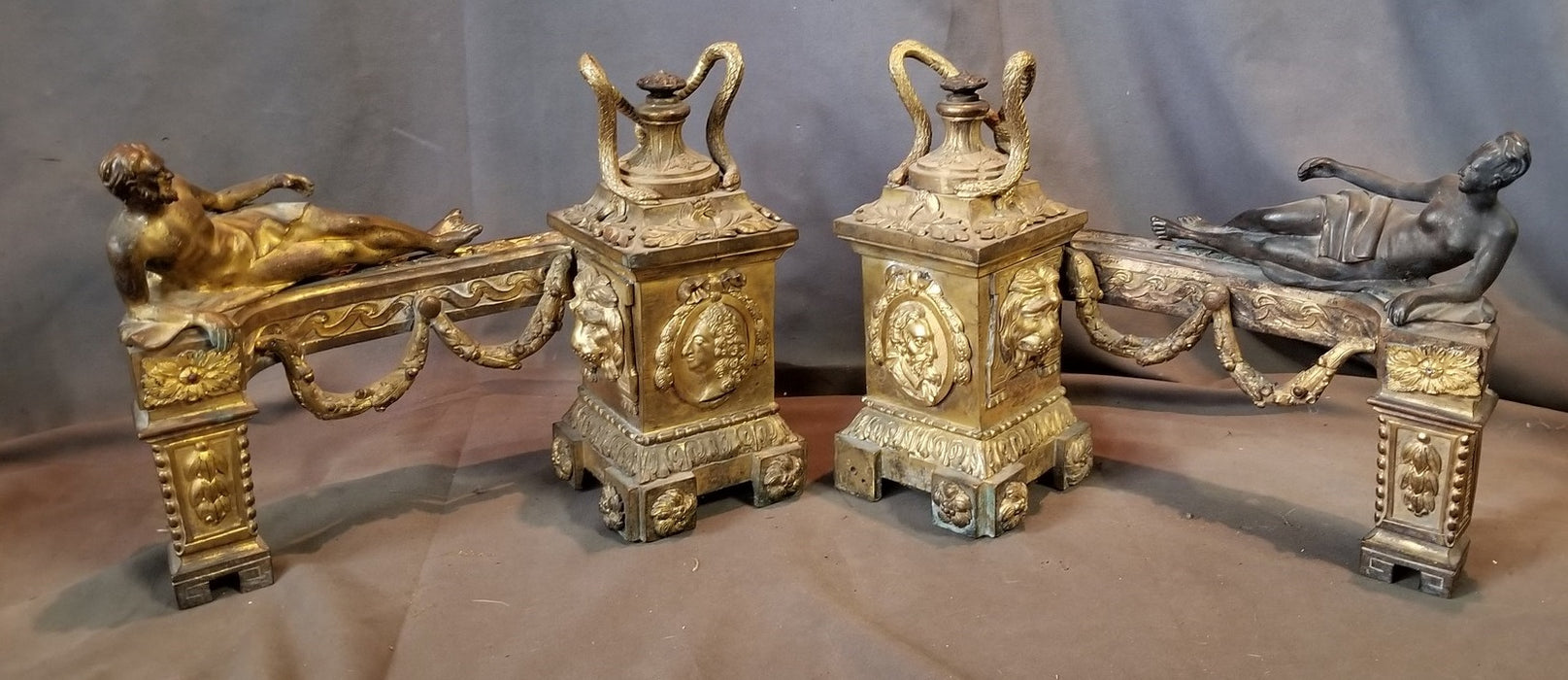 PAIR OF SMALL BRASS ANDIRONS WITH CLASSICAL FIGURES AND SNAKES