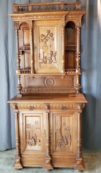 FRENCH OAK BUFFET WITH CARVED DRINKING FOLKS