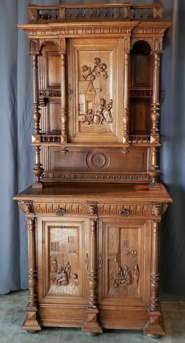 FRENCH OAK BUFFET WITH CARVED DRINKING FOLKS