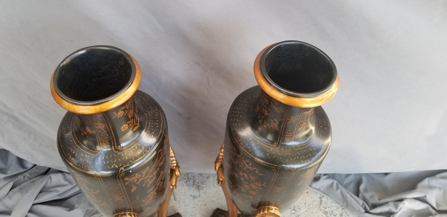 PAIR OF BLACK AND GOLD VASES ON LEGS - NOT OLD