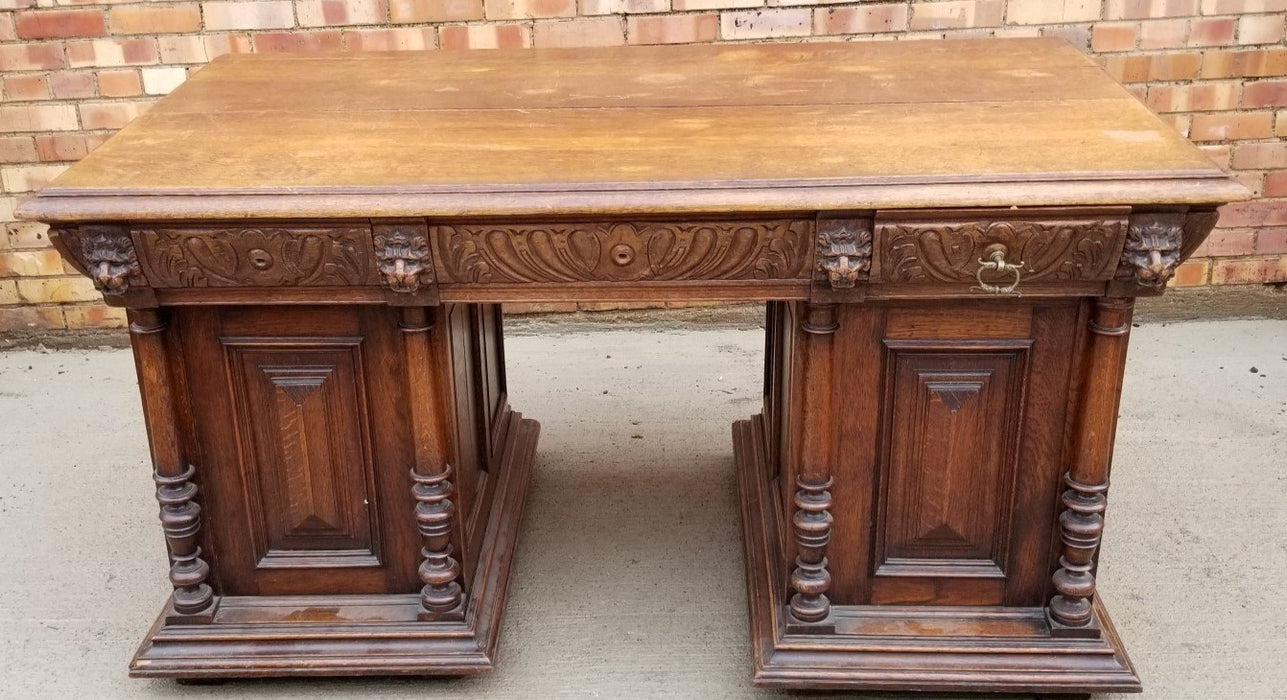 CARVED OAK LION DESK WITH DOUBLE PEDESTALS