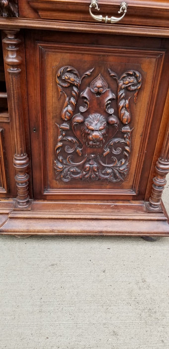 LARGE CARVED WALNUT BUFFET WITH COLUMNS AND LIONS AND SWAGS