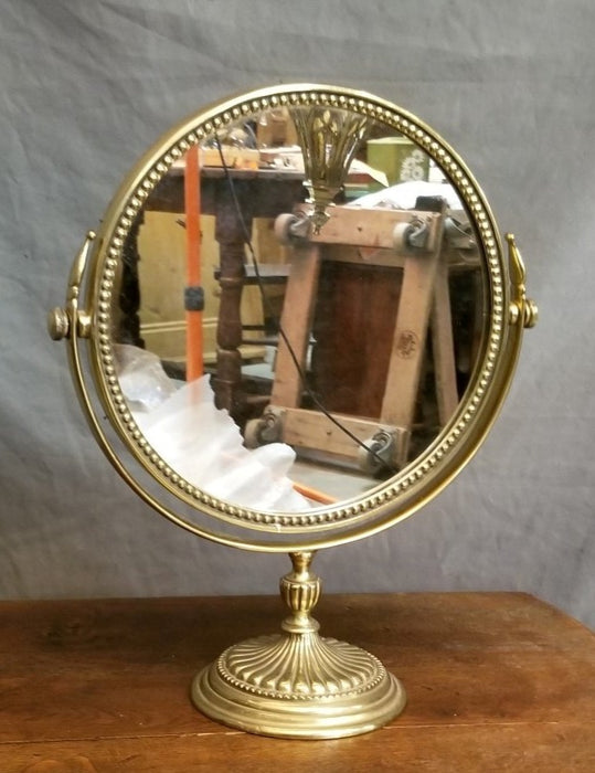 SOLD SWIVEL BRASS VANITY MIRROR