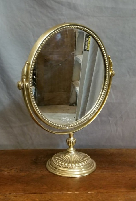 SOLD SWIVEL BRASS VANITY MIRROR