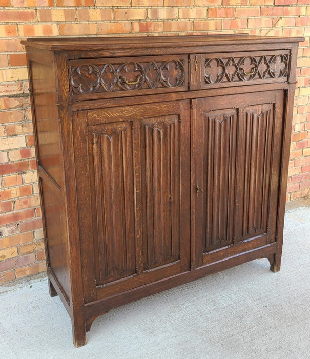 TALL SHALLOW GOTHIC CABINET WITH QUATRIFOIL