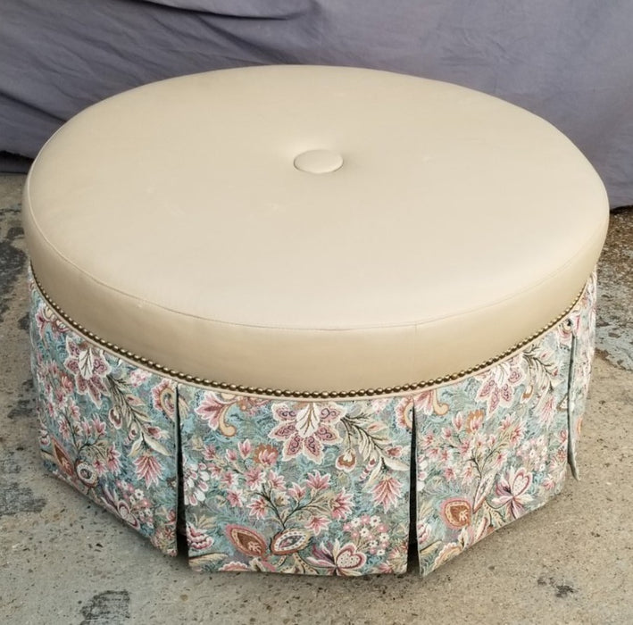 ROUND OTTOMAN WITH VINYL TOP AND UPHOLSTERED PANELS