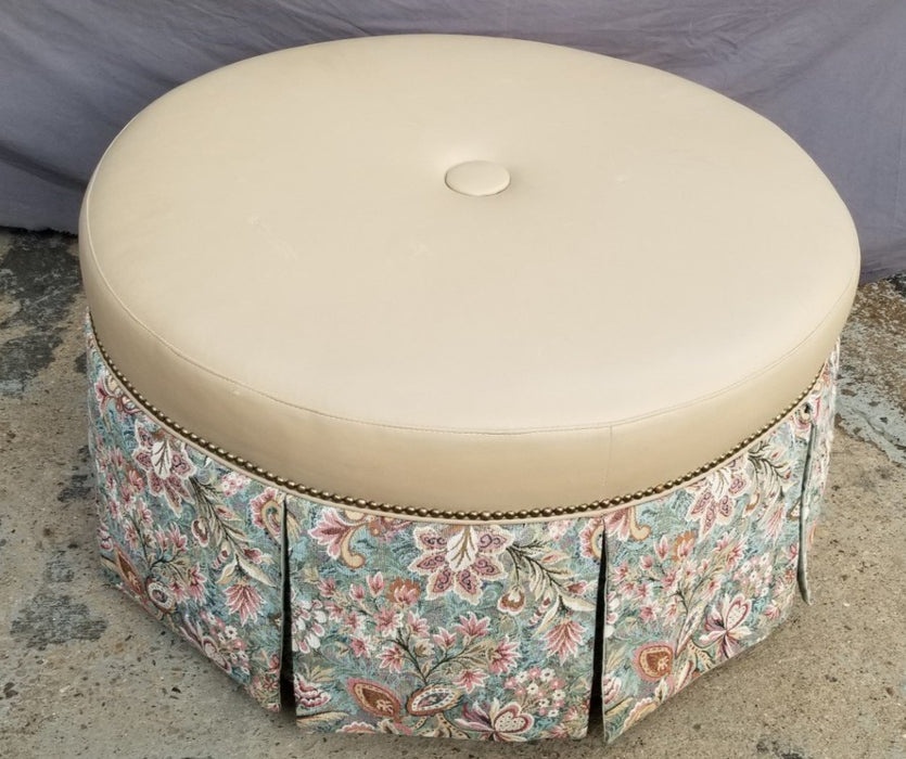 ROUND OTTOMAN WITH VINYL TOP AND UPHOLSTERED PANELS